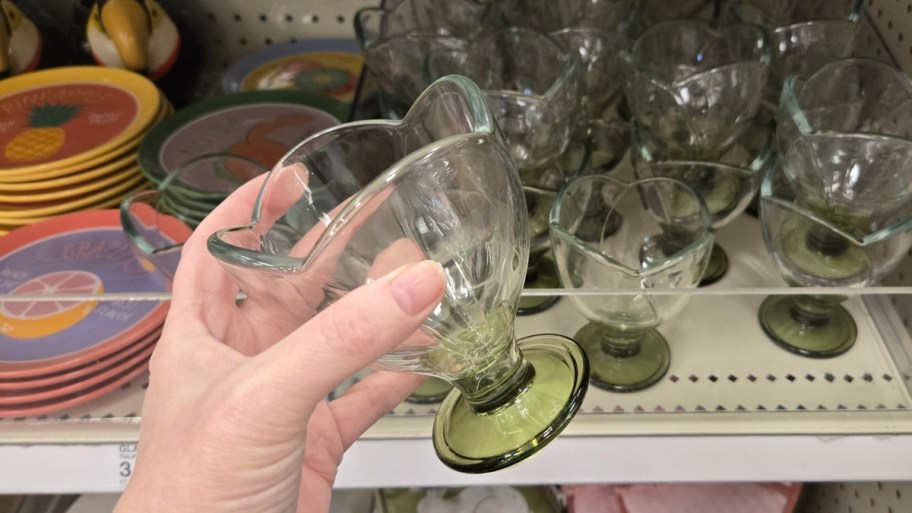 Woman's hand holding plastic wine glass