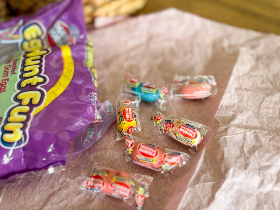 a bag of individually wrapped bubble gum pieces dumped on the table
