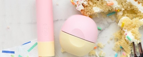 eos Birthday Cake Lip Balms on table near slice of cake