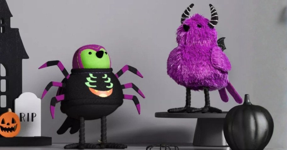 two Halloween themed decorative birds
