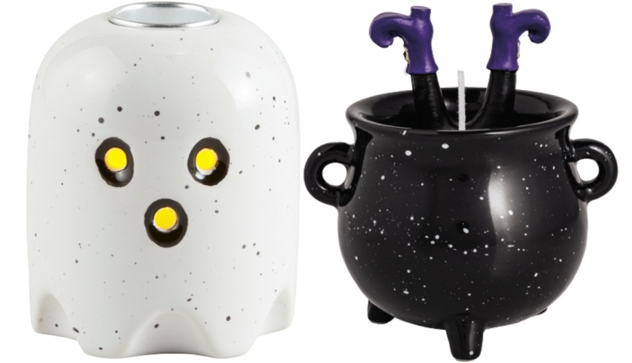 a ghost taper holder and with cauldron figural candle