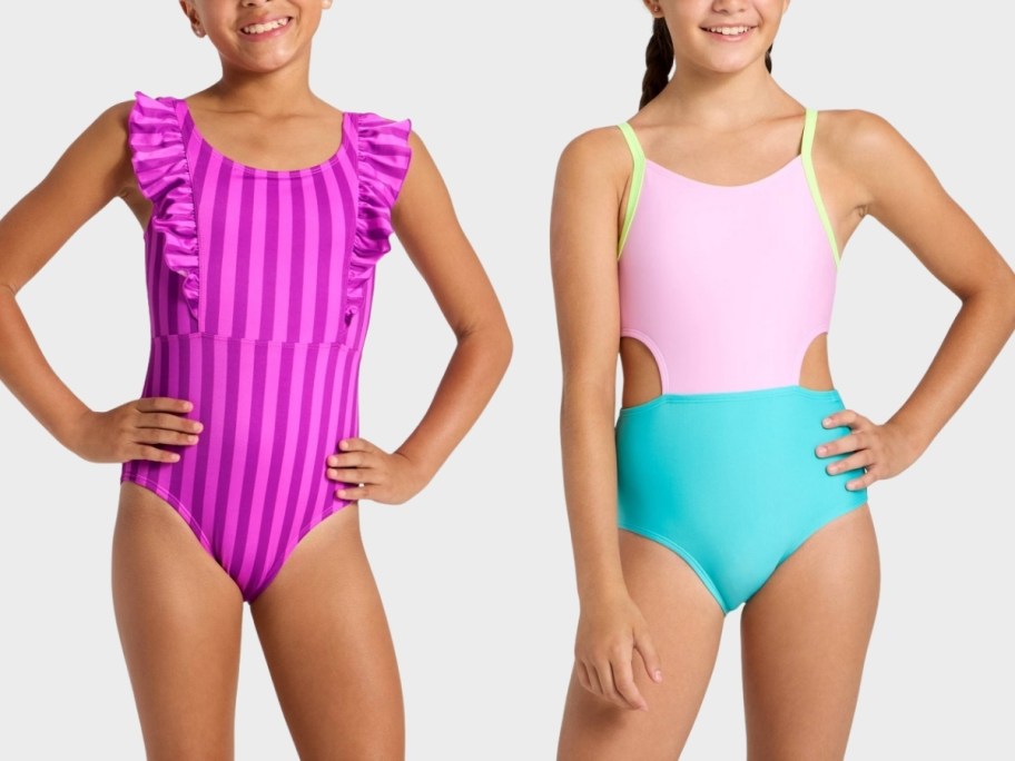 two girls wearing one piece swimsuits