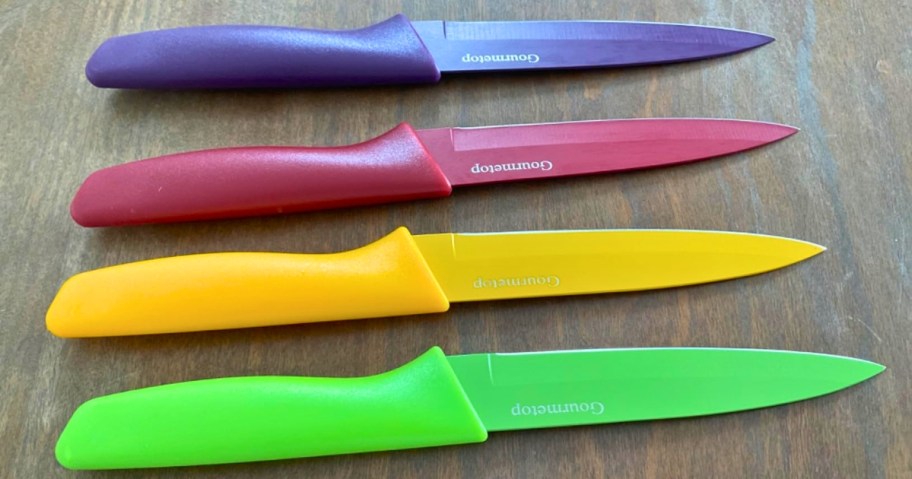 four colorful paring knives