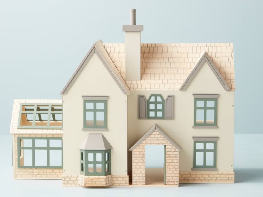 a wooden toy doll house
