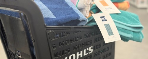 a Kohl's shopping cart filled with beach towels