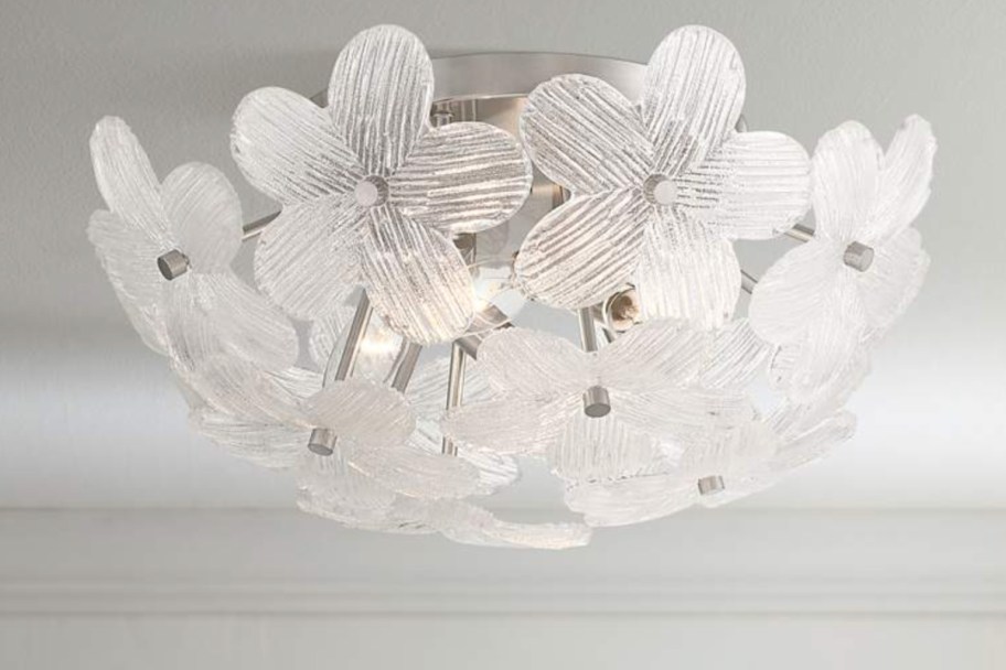 white flowers surrounding ceiling light