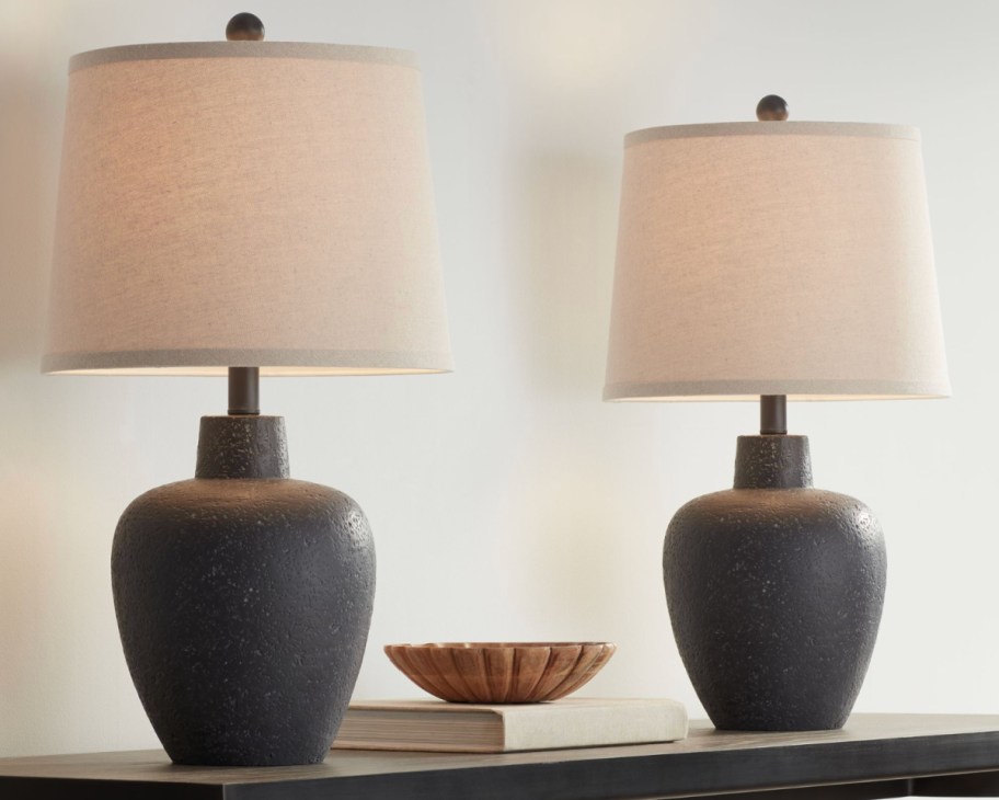 two brown round stone table lamps
