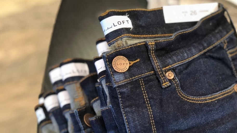loft jeans on a display table in a store