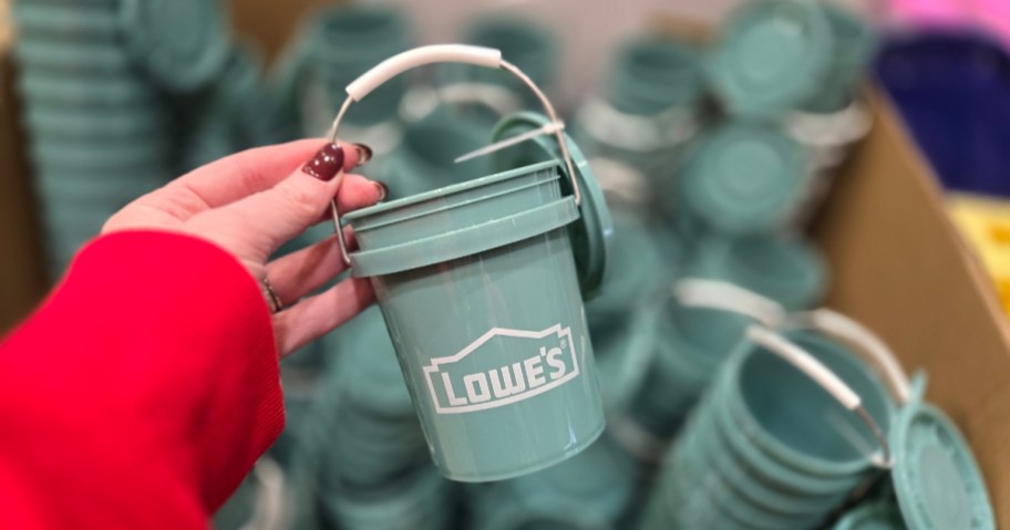 hand holding Lowe's Teal Mini Bucket in store