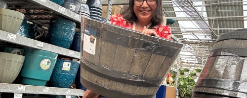 woman holding whiskey barrel