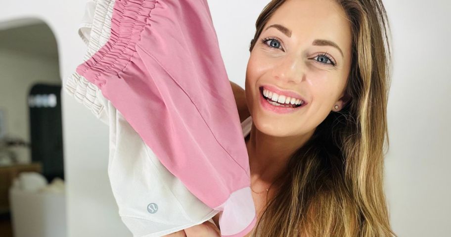 woman holding lululemon shorts