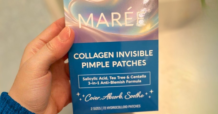 hand holding a box of Maree pimple patches