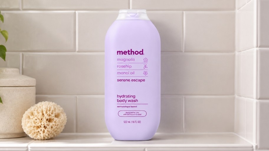 a bottle of body wash on a tiled shelf