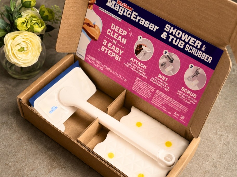 a box with a Mr. Clean Magic Eraser Tub & Shower Scrubber