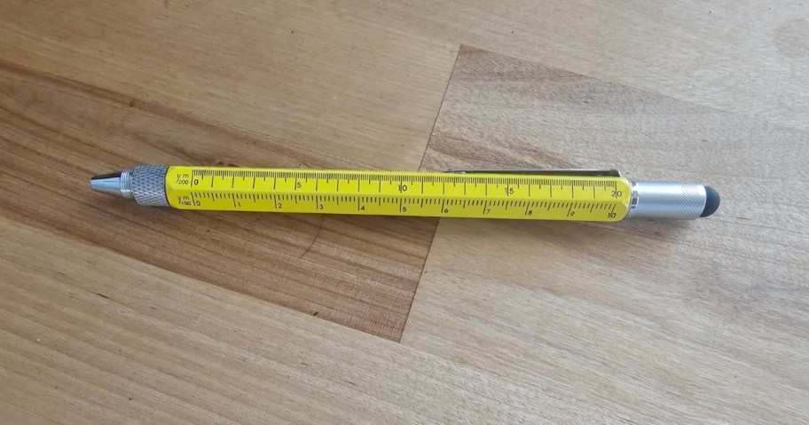 a yellow multipen tool on a tabletop