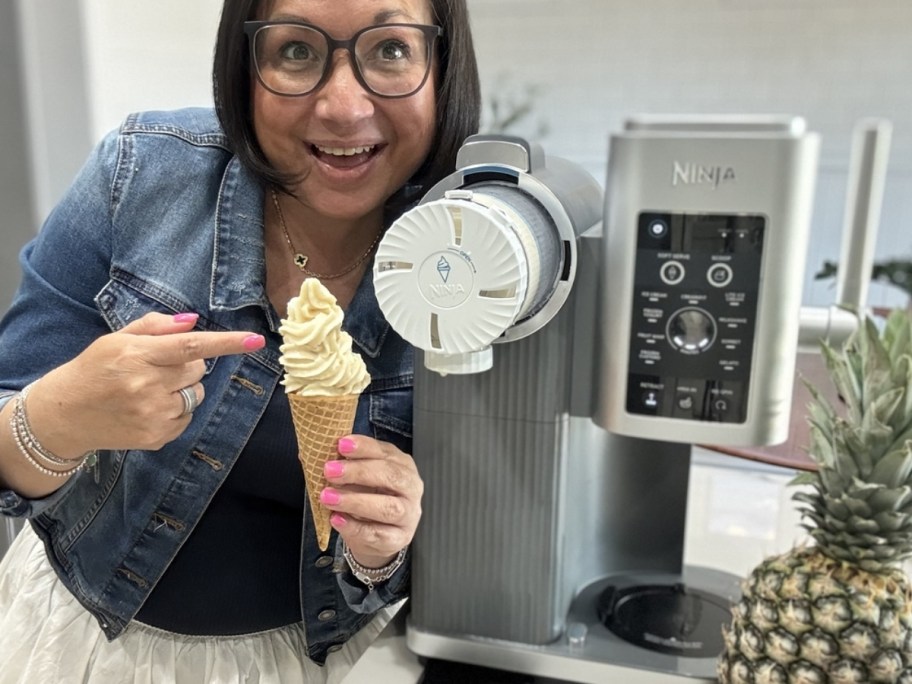 a woman with a ninja cremi holding a cone of softserve