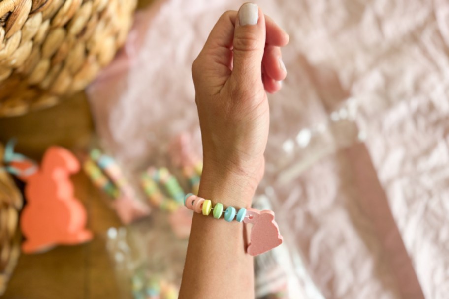 Arm and candy bunny with candy bracelet on wrist