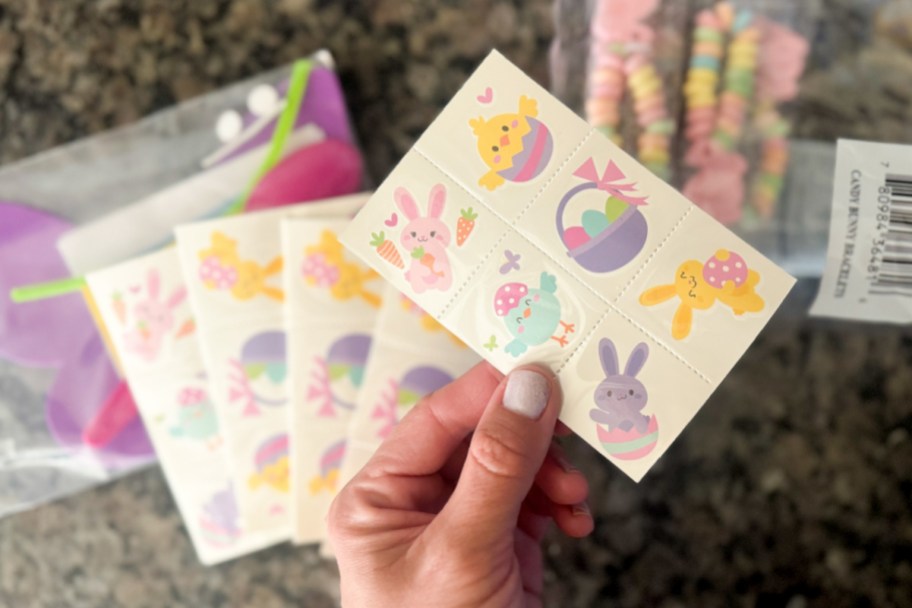 Hand holding easter temporary tattoo sheet