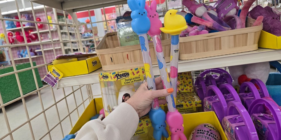 hand holding peeps batons