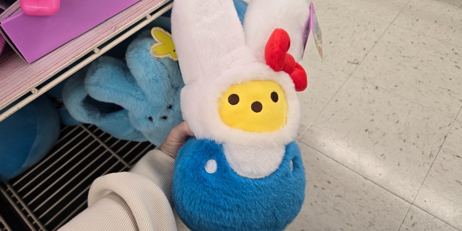hand holding peeps plush