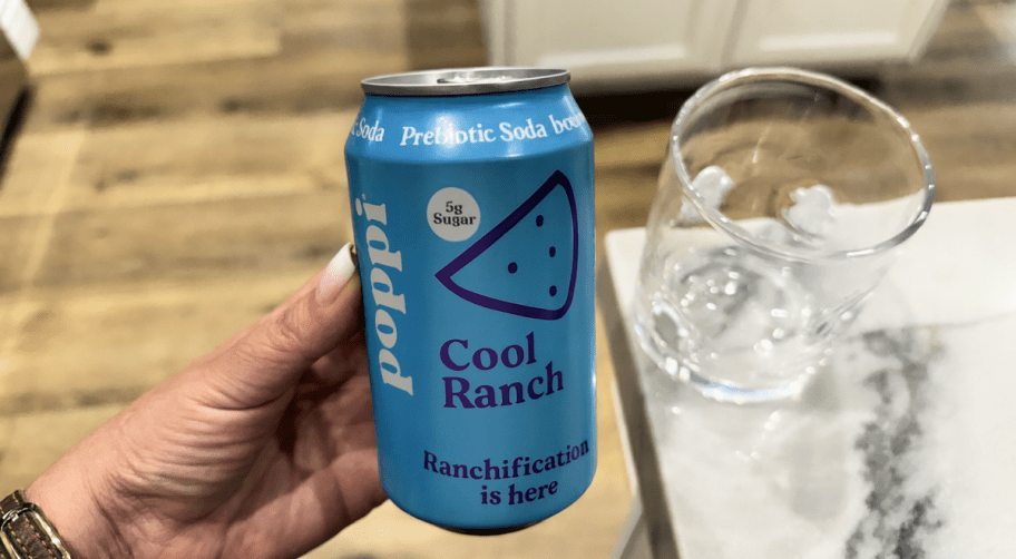 holding a ranch poppi soda april fools 