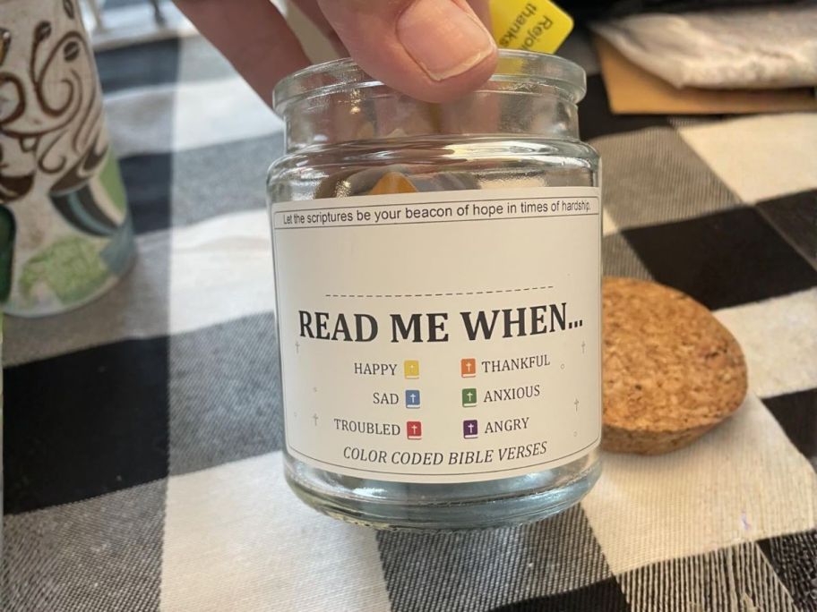 hand holding read me when jar