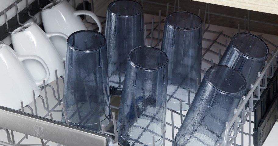 retro plastic cups in a dishwasher with white mugs