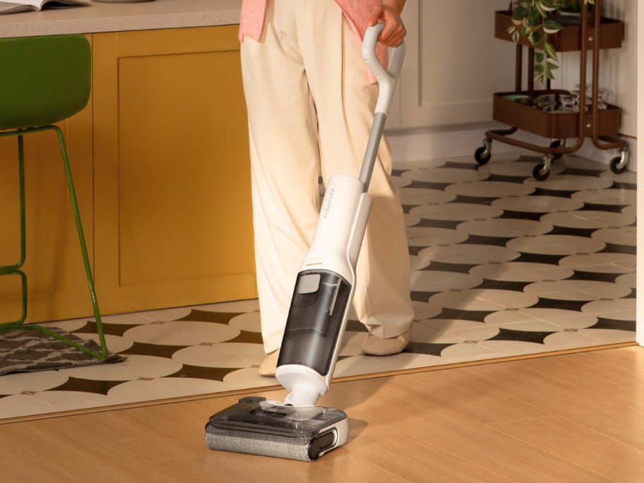 person using a a wet dry vacuum