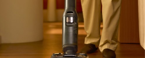 person using a a wet dry vacuum