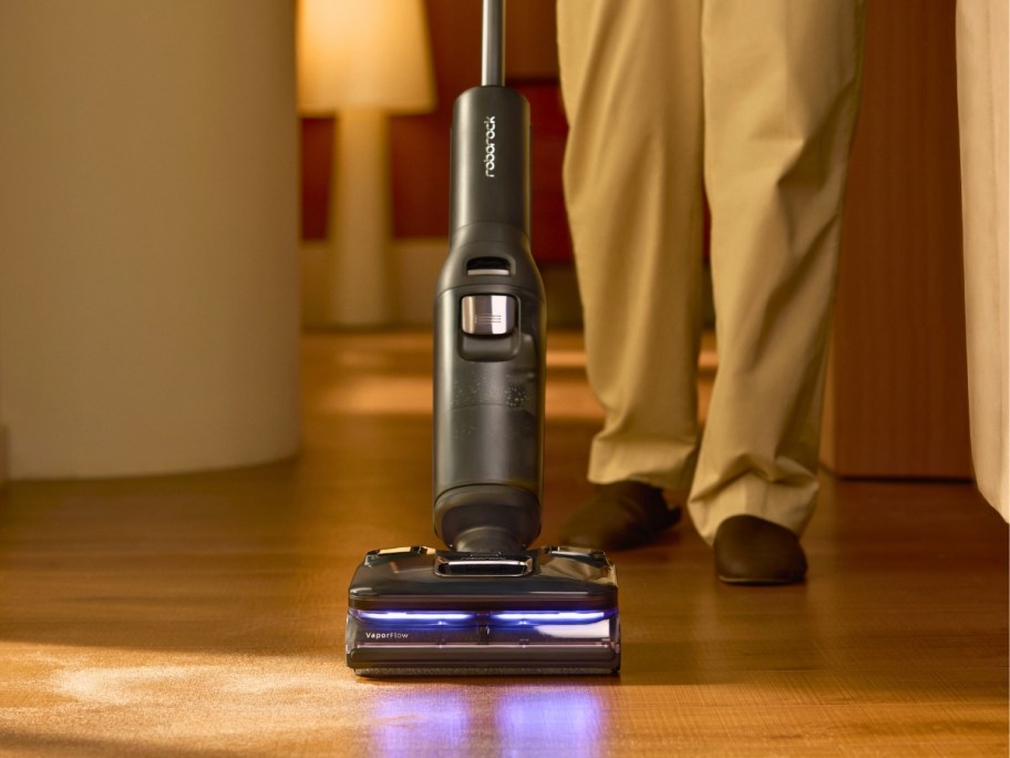person using a a wet dry vacuum