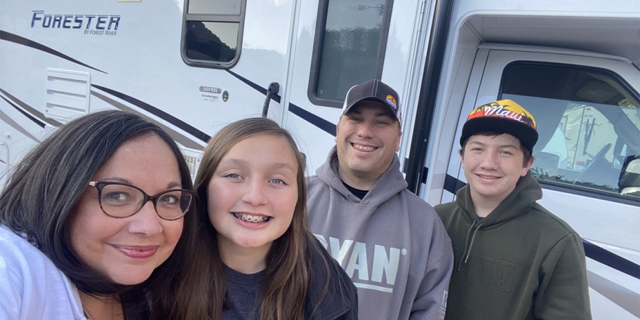 family in front of rv