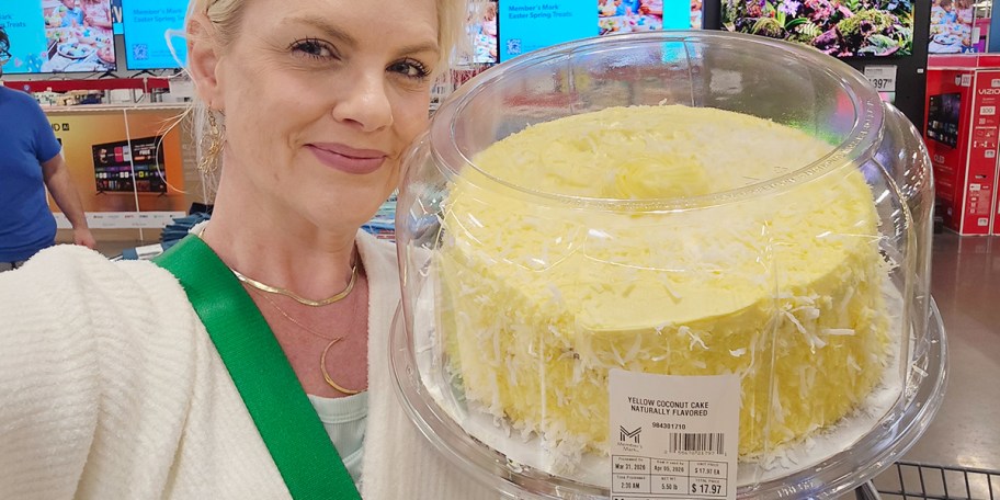 woman holding yellow coconut cake 