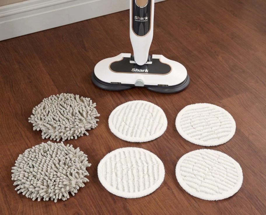 a shark steam mop shown with 6 mopping pads