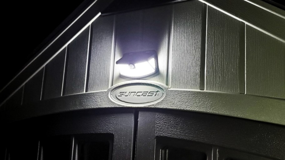 a solar spot light about a shed door