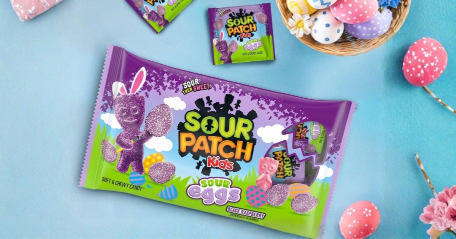 a bag of Sour Patch Kids Sour Eggs with individual bags and Easter Eggs around it