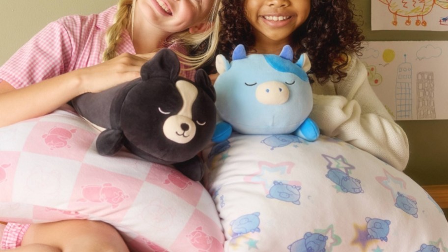 two girls with squishpillows plush sets