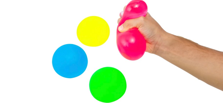 hand holding squishy toys 