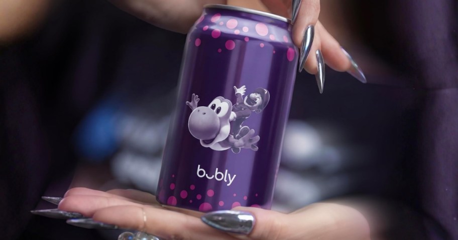 hand holding a Super Mario bubly can drink with Yoshi on it