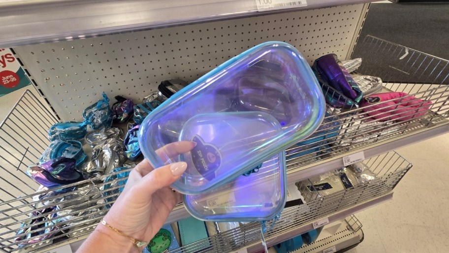 womans hand holding transparent cases in two sizes