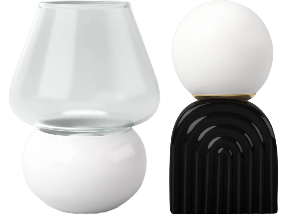 Two modern table lamps are displayed. One features a clear glass top with a white spherical base; the other has a white orb above a black, arch-patterned base.