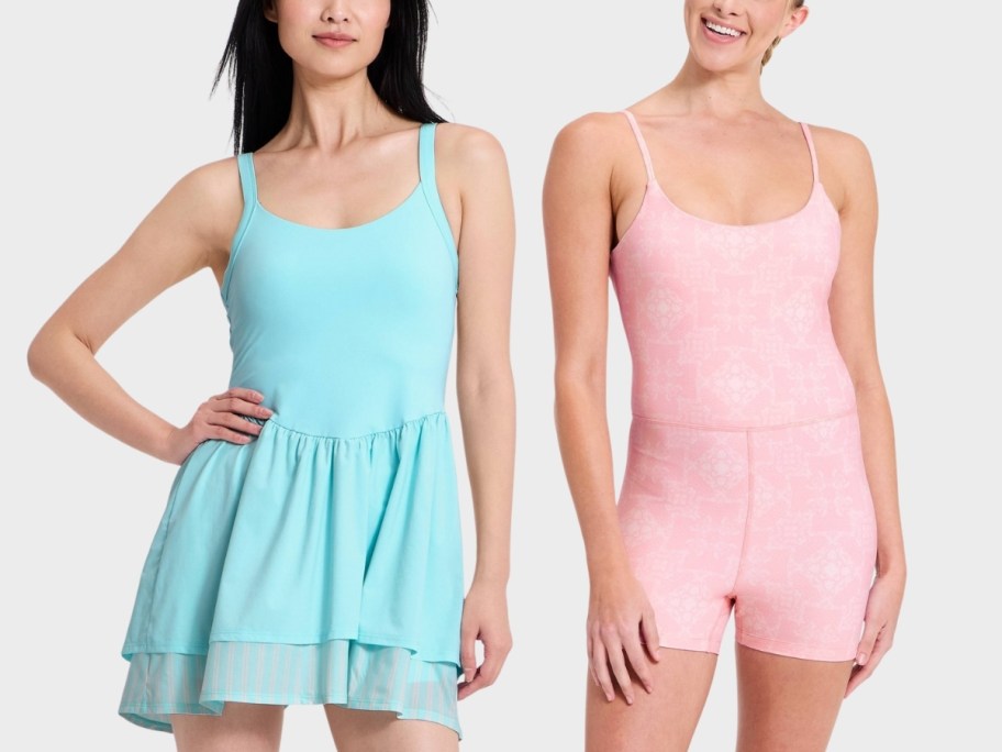a woman in a light aqua dress and a woman in a pink printed bodysuit