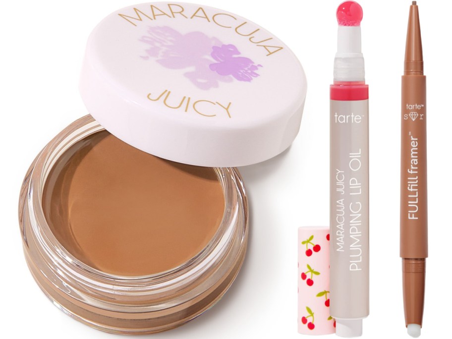 Open jar of creamy brown makeup next to lip oil and lip liner. The jar has a white lid with purple floral design.