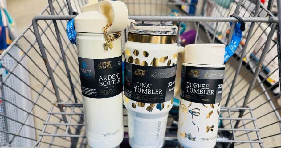 3 cream and gold Thyme & Table tumblers and bottles in a Walmart cart