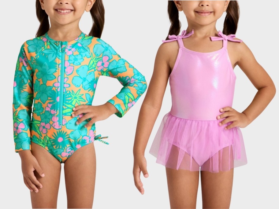 toddler girl in a rash guard swimsuit and a toddler girl in a tutu swim suit