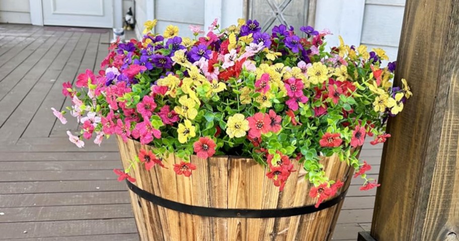 colorful artificial flowers in a a wooden pot