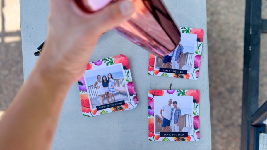 3 walgreens photo coasters on outdoor side table