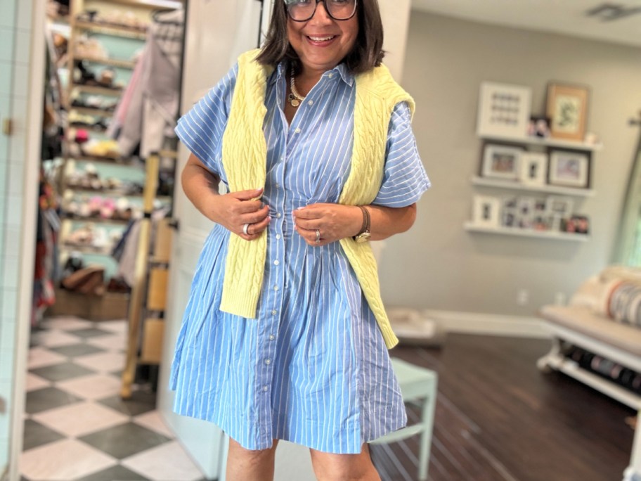 woman in blue stripe dress with yellow cardigan