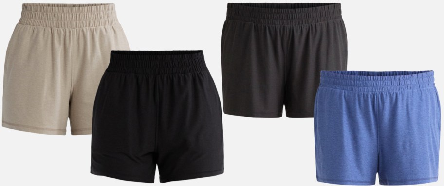 Four pairs of casual shorts are on display: beige, black, dark gray, and blue. All shorts have an elastic waistband.