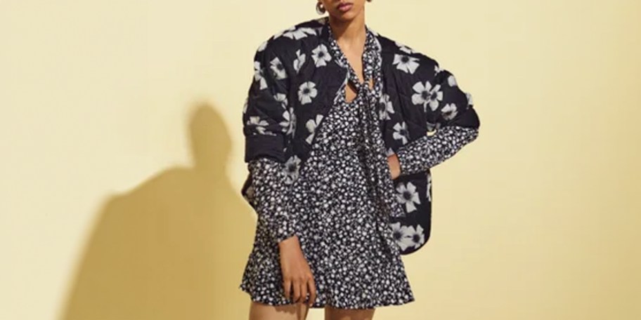 woman wearing black floral dress 