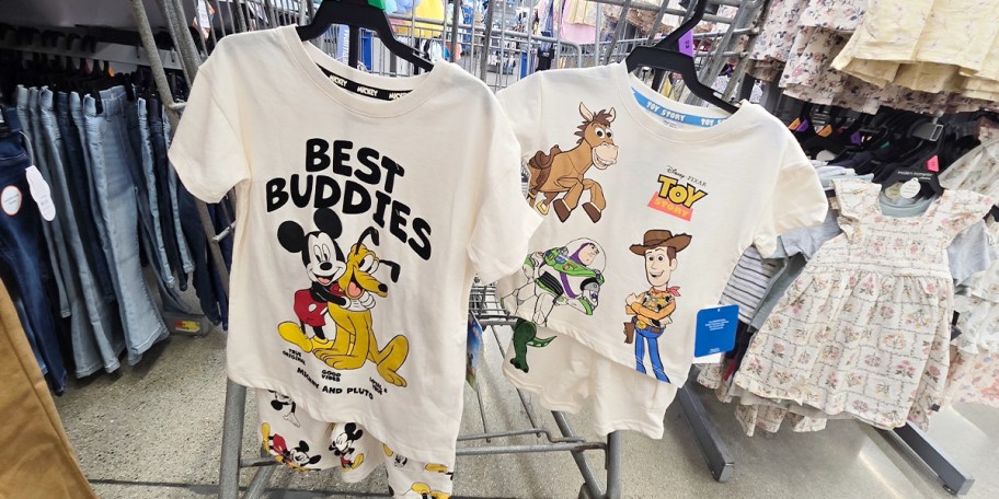 mickey mouse and toy story 2 piece sets hanging on cart 
